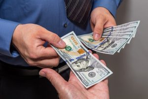 handing dollars